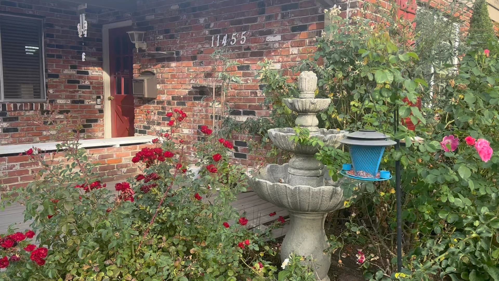 Angel Light’s rose garden, fountain, and brick front porch.